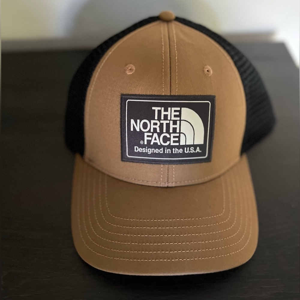 Brown/black north face trucker style hat